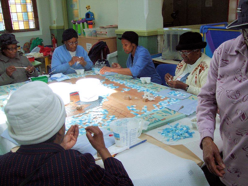 The choir creating the mosaic at Springfield Library